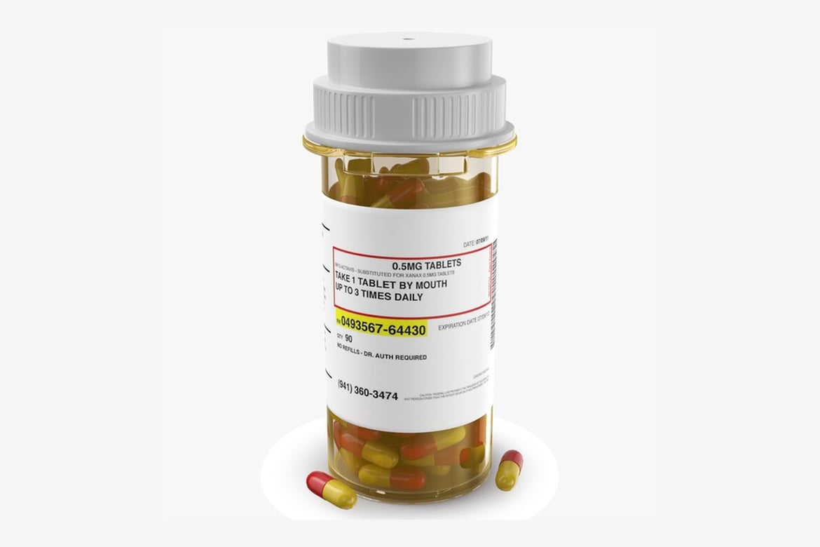 Download Pill Bottle, Pharmaceutical Container with Scattered Yellow and Red Capsules 3D Model